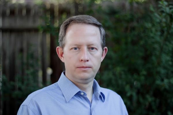 Boris Maiorov; a middle aged white man with light brown hair and a blue collared shirt